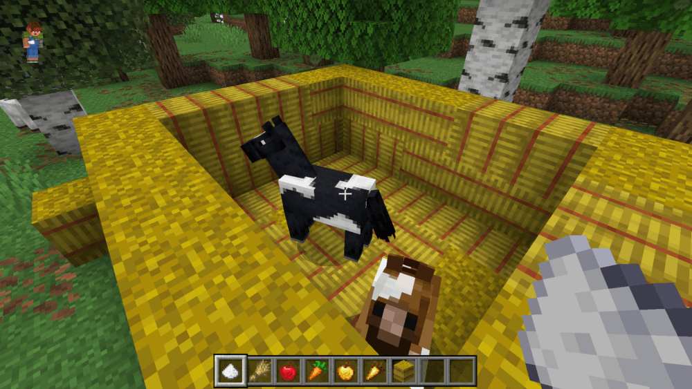 Minecraft horses in a hay bale pen with horse food items