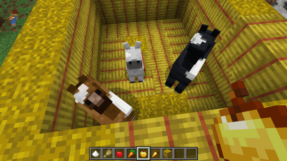 Minecraft two horses with a foal in a hay bale pen