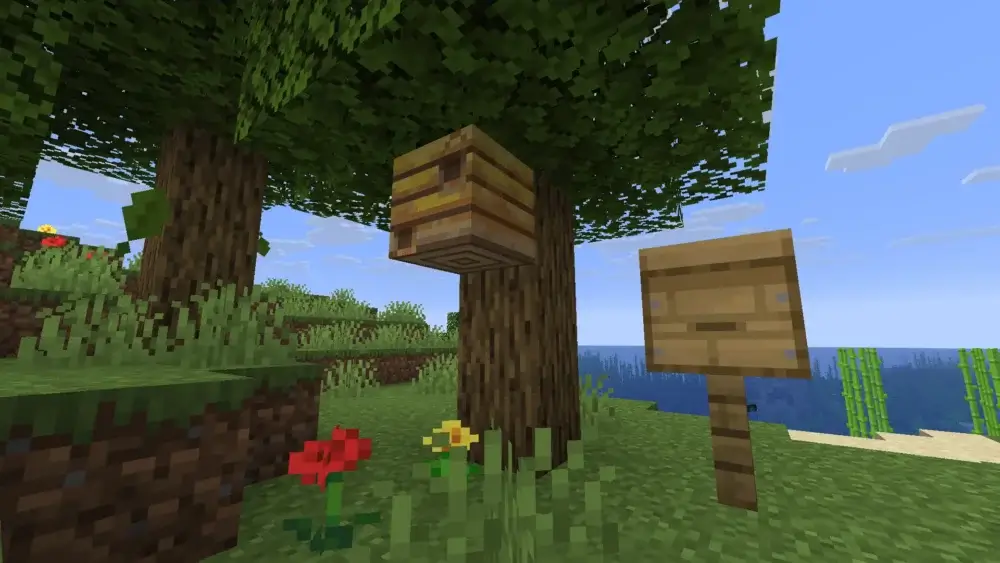 Minecraft bee nest and beehive displayed next to each other near an oak tree