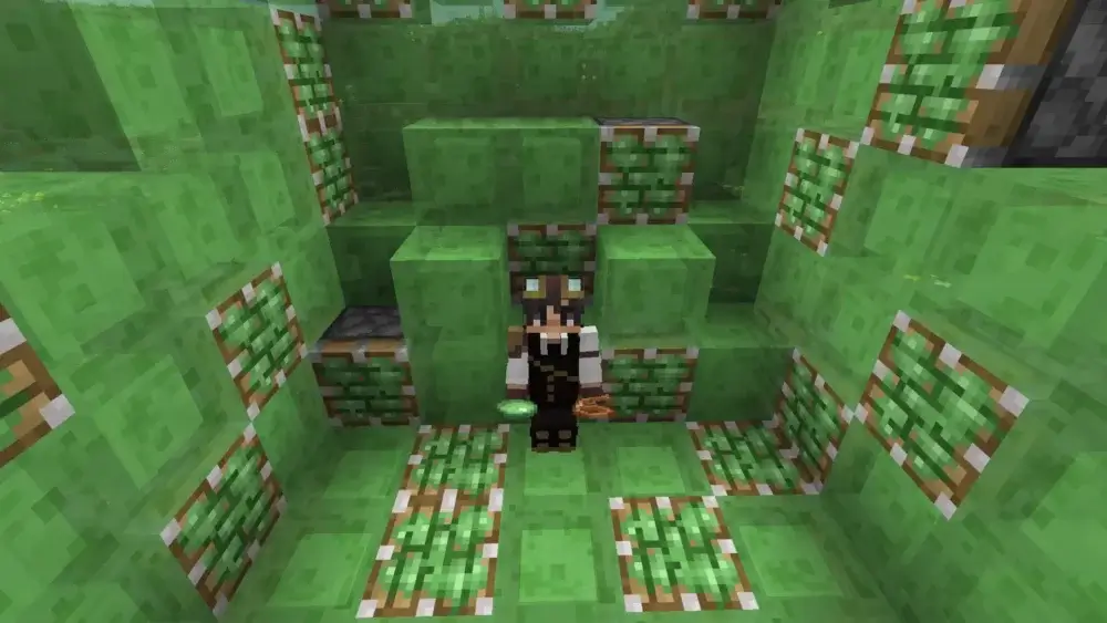 Minecraft player surrounded by slime blocks and sticky pistons