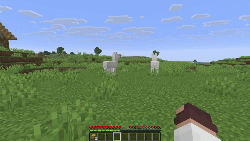 Two white llamas standing in a grassy plains biome in Minecraft