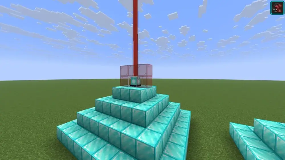 Minecraft beacon emitting a red beam through red stained glass