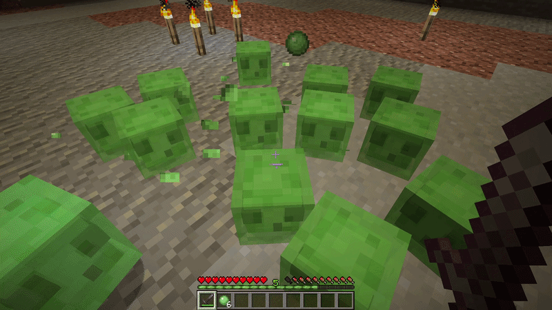 Small Minecraft slimes surrounding the player with a slimeball drop