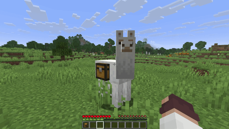 Minecraft llama equipped with a chest in a grassy plains biome
